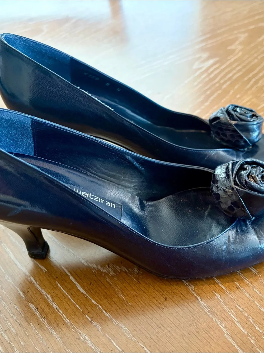 Stuart Weitzman Black Pointed Toe Pumps with Rosette